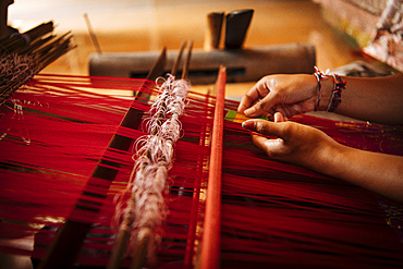 Girl weaving using traditional method, Sidemen, Bali, Indonesia, Southeast Asia, Asia