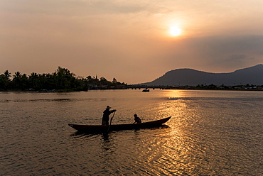 Father and son fishing on Kampong Bay River at sunset, Kampot, Cambodia, Indochina, Southeast Asia, Asia 