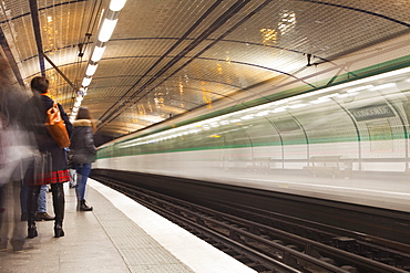 A metro train arrives at Concorde station, Paris, France, Europe