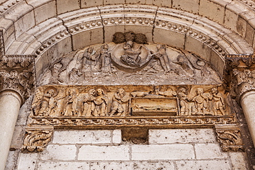 Ancient stonework on an old church door at La Charite-sur-Loire, France, Europe