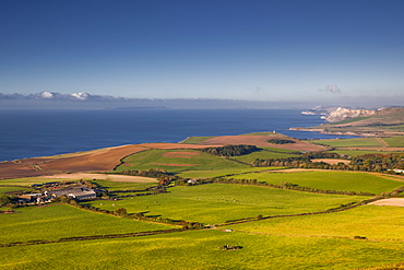 Looking across the Dorset coastline to Kimmeridge Bay and Clavell Tower, Jurassic Coast, UNESCO World Heritage Site, Dorset, England, United Kingdom, Europe