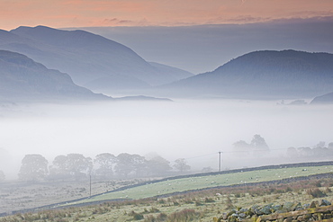 A heavy mist in the valley below High Rigg in the Lake District National Park, Cumbria, England, United Kingdom, Europe