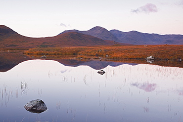 Lochan na h-Achlaise reflecting the surrounding mountains on Rannoch Moor, a Site of Special Scientific Interest, Scotland, United Kingdom, Europe