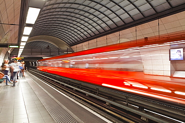 A train pulls out of a station on the Lyon metro system, Lyon, Rhone, Rhone-Alpes, France, Europe