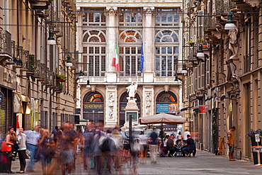 A bustling Via Giuseppe Garibaldi with Palazzo Madama at the end, Turin, Piedmont, Italy, Europe