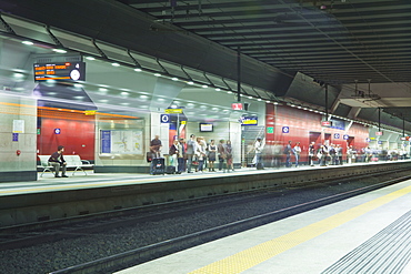 People waiting for a train in Porta Susa, Turin, Piedmont, Italy, Europe