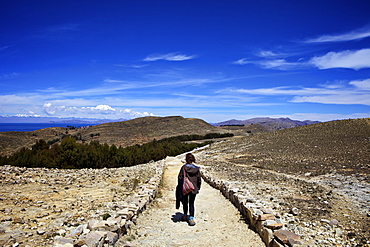 Walking down the path to the centre of the island, Isla del Sol, Lake Titicaca, Bolivia, South America