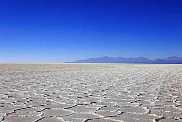 Details of the salt deposits in the Salar de Uyuni salt flat and the Andes mountains in the distance in south-western Bolivia, Bolivia, South America