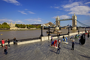 South Bank of the River Thames, Tower of London and Tower Bridge in background, London, England, United Kingdom, Europe