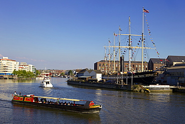 Boats passing the SS Great Britain in Bristol Floating Harbour, Bristol, England, United Kingdom, Europe