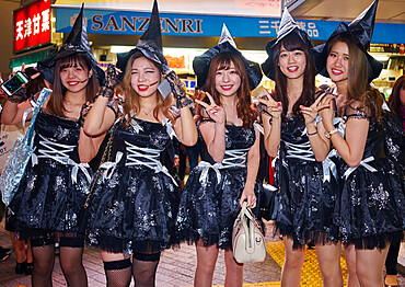 A group of young Japanese girls dressed as witches at the Halloween celebrations in Shibuya, Tokyo, Japan, Asia