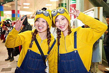 Young Japanese girls dressed as Minions at the Halloween celebrations in Shibuya, Tokyo, Japan, Asia