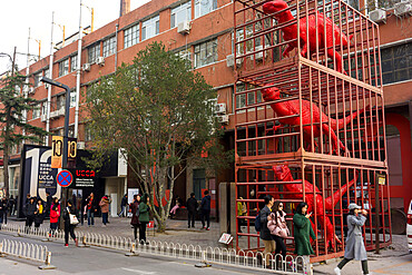 Red dinosaurs sculpture by Sui Jianguo in Dashanzi Art District, Beijing, China, Asia