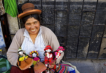 Indigenous lady selling dolls, Arequipa, Peru, South America