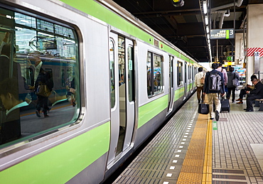 A Tokyo subway train at a station, Tokyo, Japan, Asia