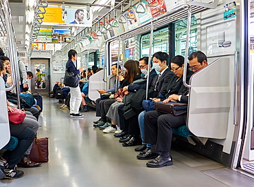 Passengers on a Tokyo subway train, Tokyo, Japan, Asia