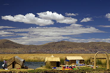 Floating islands of the Uros people, traditional reed boats and reed houses, Lake Titicaca, peru, peruvian, south america, south american, latin america, latin american South America