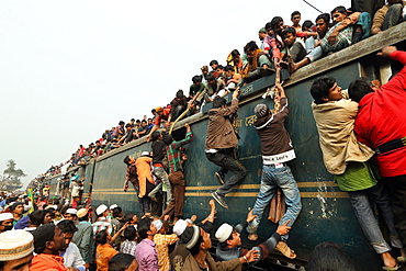 Muslims returning home after the Biswa Ijtema by taking risky ride on an overcrowded train. It is the second largest Muslim pilgrimage after Haj at Tongi, Bangladesh