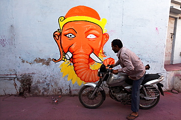 Motorcyclist and modern representation of Ganesh, Rajasthan India