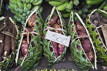 Baskets of sweet potato (Ipomea batatas) on the market of Port Vila, Efate Island. Vanuatu.