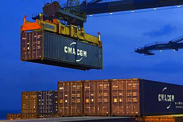 Container at the end of a crane, Port Kelang, Malaysia.