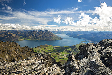 View from Remarkables mountain range on Lake Wakatipu with city of Queenstown, South Island, New Zealand