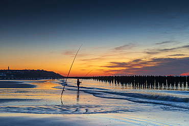 Fisherman at sunset on the beach of Tardinghen, Opal Coast, Hauts de France, France