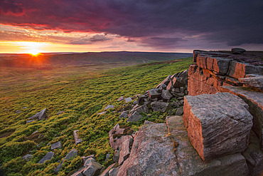 Sunset at Stanage Edge, UK. The sun sets over Stanage Edge in the Peak District, UK.