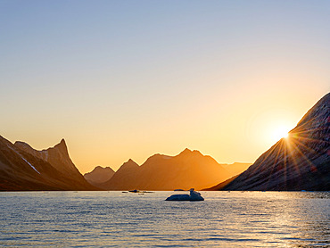 Sunset in the Ikateq Fjord. Ammassalik area in East Greenland. North America, Greenland, Danish Territorrry