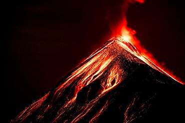 Volcán de Fuego (Volcano of fire) eruption at night, Sierra Madre de Chiapas, Guatemala.