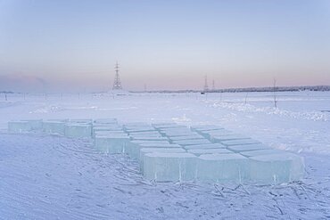 Extraction of ice cube from the Lena river for use as drinking water by residents without access to running water, Yakutsk, Republic of Sakha, Russia