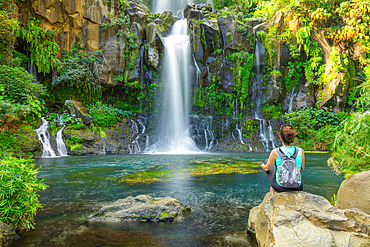 Woman at the edge of Bassin des Aigrettes, Saint Gilles, Reunion Island, France