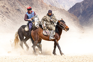 Riders at a game of Kok-boru (or Ulak-tartish or Buzkachi), Central Asian equestrian games at the Noorus festival, Kotchkor, Naryn Region, Kyrgyzstan