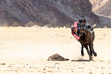 Riders at a game of Kok-boru (or Ulak-tartish or Buzkachi), Central Asian equestrian games at the Noorus festival, Kotchkor, Naryn Region, Kyrgyzstan