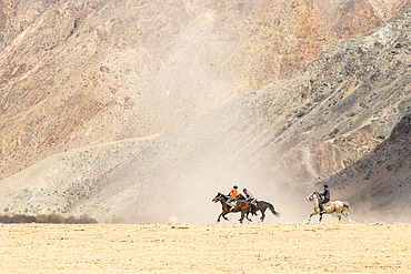 Riders at a game of Kok-boru (or Ulak-tartish or Buzkachi), Central Asian equestrian games at the Noorus festival, Kotchkor, Naryn Region, Kyrgyzstan