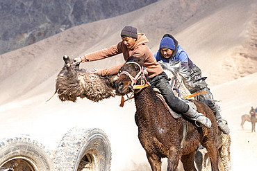 Riders at a game of Kok-boru (or Ulak-tartish or Buzkachi), Central Asian equestrian games at the Noorus festival, Kotchkor, Naryn Region, Kyrgyzstan