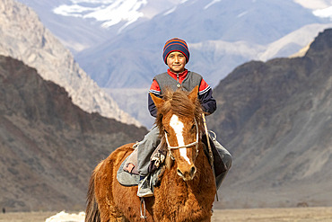 Riders at a game of Kok-boru (or Ulak-tartish or Buzkachi), Central Asian equestrian games at the Noorus festival, Kotchkor, Naryn Region, Kyrgyzstan