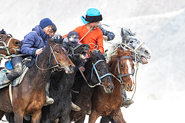 Riders at a game of Kok-boru (or Ulak-tartish or Buzkachi), Central Asian equestrian games at the Noorus festival, Kotchkor, Naryn Region, Kyrgyzstan