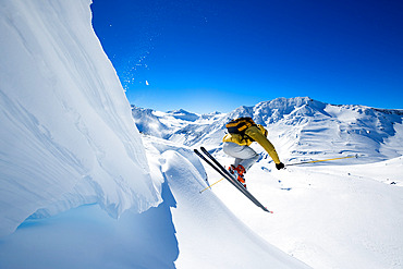 Skier jumping in front of a serac on the north face of Copahue volcano Caviahue, Patagonia, Argentina