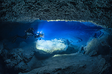 Tek (Trimix) speleologist diver in a karstic underwater cave over 70 meters deep, Photogrammetry, twiglight zone, Mayotte