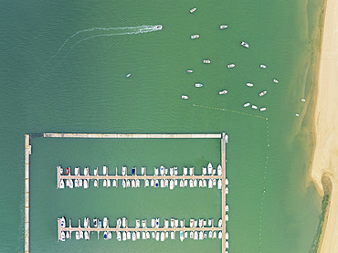 Marina wharves at the river mouth of the Piedras River. Aerial view. Drone shot. Huelva province, Andalusia, Spain.