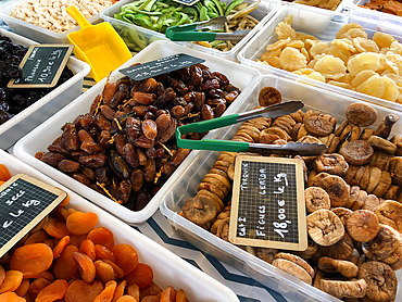 Dates, apricots, figs, pineapple, ginger, dried prunes on a market stall