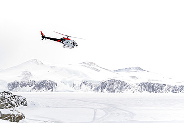 A German BGR helicopter used in Terre Victoria to transport geologists to specific research points. These are one-off scientific programs, involving the collaboration of several countries, in this case Germany and Italy. The Germans set up a base camp several dozen kilometers from the Italian Mario Zucchelli station, using Italian logistical resources such as the Laura Bassi icebreaker to transport the helicopter, the equipment needed to set up the base camp, scientific equipment and, of course, personnel. All of this was delivered to the Mario Zucchelli station for onward transport by helicopter to the search site. Victoria Land, Antarctica