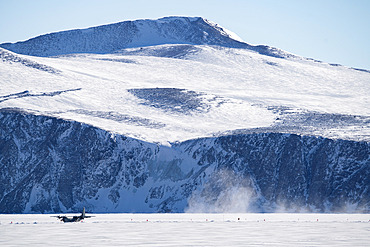 A Lockheed C-130 Hercules on loan from the Italian Air Force for logistics operations between Christchurch;New Zealand) and the Mario Zucchelli base. Although military activities are strictly forbidden in Antarctic territory by the Treaty of Madrid, polar-operating countries frequently use the skills and equipment of their armies for polar logistics. Victoria Land, Antarctica