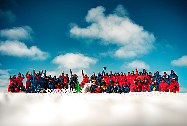 Concordia technicians and scientists, Christmas tree, Concordia in letters made of ice/snow, Igloo. Group photo of the team at Concordia during the summer. The Italians are in red and the French in blue. The ratio is about half Italians and half French; half technicians and half scientists. Concordia Antarctic Research Station, Dome C plateau, East Antarctica.