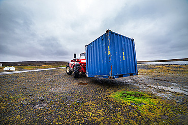Loading a container onto a tray to move it to another location at the Port-aux-Francais base. Kerguelen Islands
