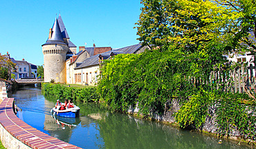 Electric boat on the Huisne river under the name La Venise de l'Ouest. Medieval town of La Ferte Bernard (the beginning of Perche), Sarthe, Pays de la Loire, France