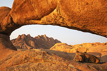 The Pondok mountains seen through "The Bridge" belong to the Spitzkoppe mountain compound. Damaraland, Namibia.