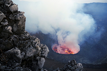 volcano Nyiragongo crater with lava lake rising smoke nature natural phenomenon