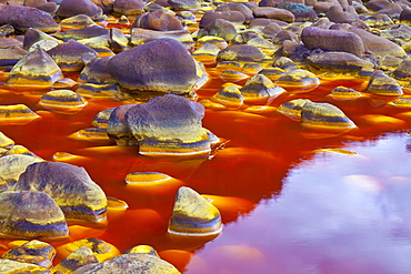 Rio Tinto red river reddish hue due to iron copper and sulfur dissolved in the water habitat with extreme conditions for life forms Andalusia